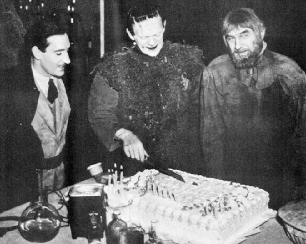 Boris Karloff celebrating his birthday with Basil Rathbone and Bela Lugosi on the set of Son of Frankenstein(1939)