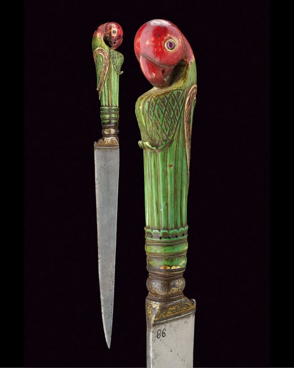 Kard Dagger, 18th century, Rajasthan, India. Damascus steel blade with ivory grip sculpted as a parrot, ruby-inlaid eyes, gilt iron ring-nut featuring floral decorations. Copyright © Czerny’s International Auction House.
