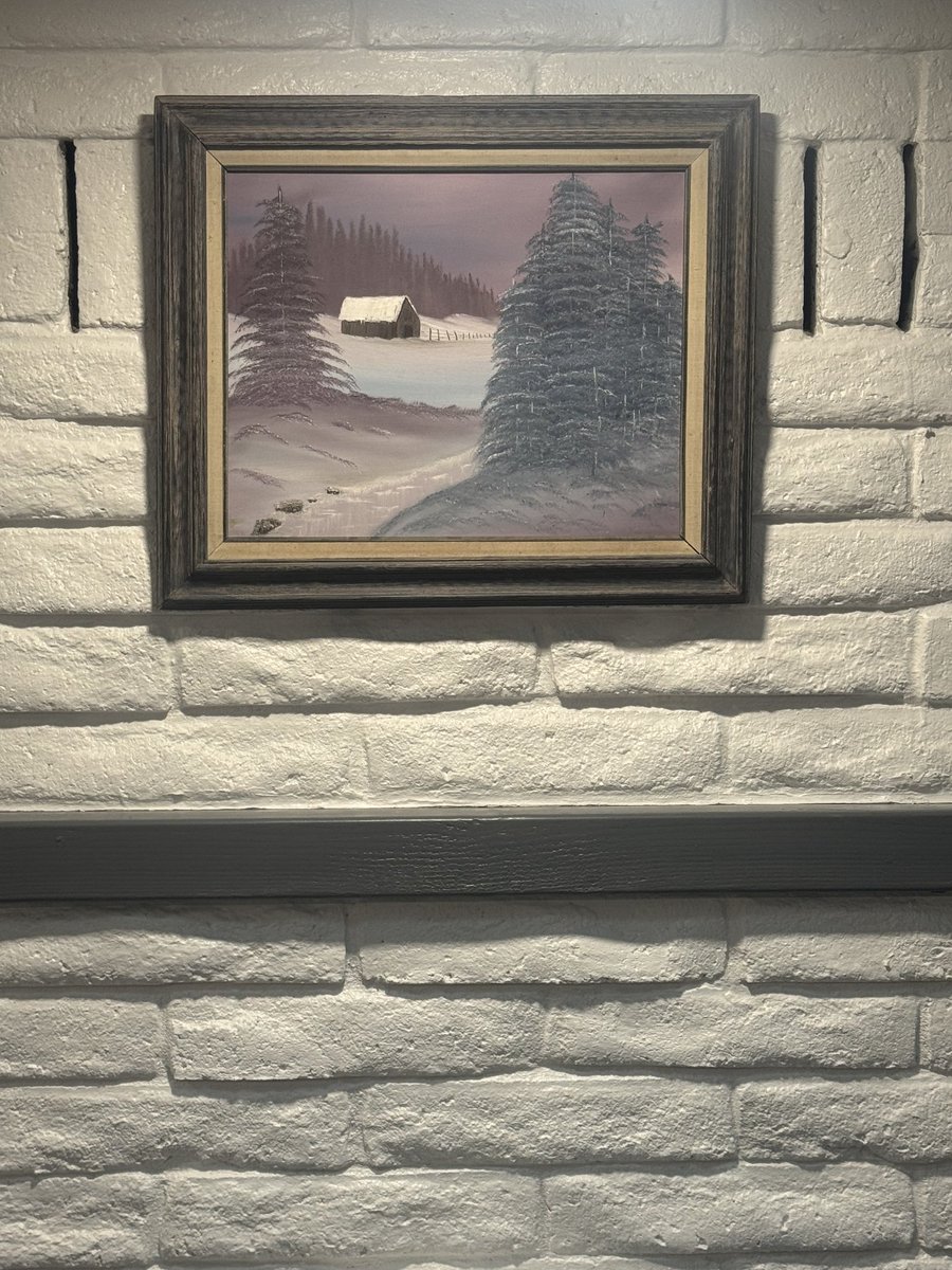 First painting hung. 
This was painted by my wife's grandmother a long time ago. We received it after she passed away and it's been a main feature in our dining room areas ever since. Now it resides over the fireplace. 
I will be adding a better mantle where that 4x4 is and the