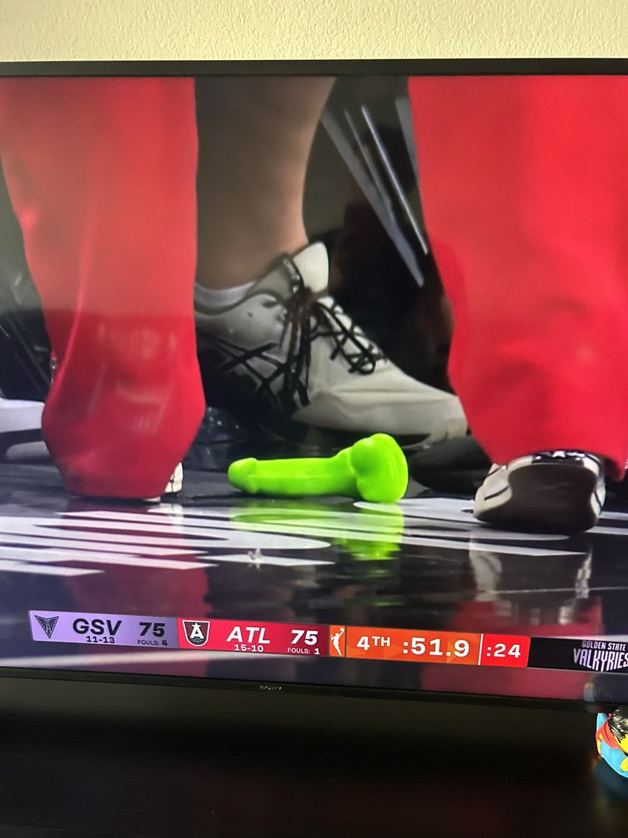 Someone threw a bright green microphone on the court of a WNBA game
