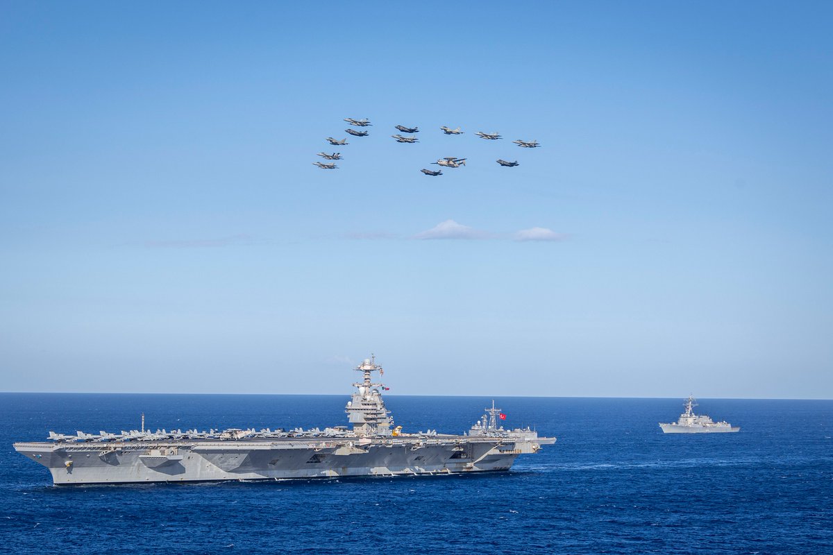 USS Gerald Ford steams in formation with the Turkish Navy’s TCG Gelibolu &amp; Arleigh Burke-class destroyer USS Bainbridge, while Italian Eurofighters and American F/A-18E, F-35, &amp; E-2D planes fly overhead in the Ionian Sea, July 29, 2025 as part of Neptune Strike 25-2 exercise.