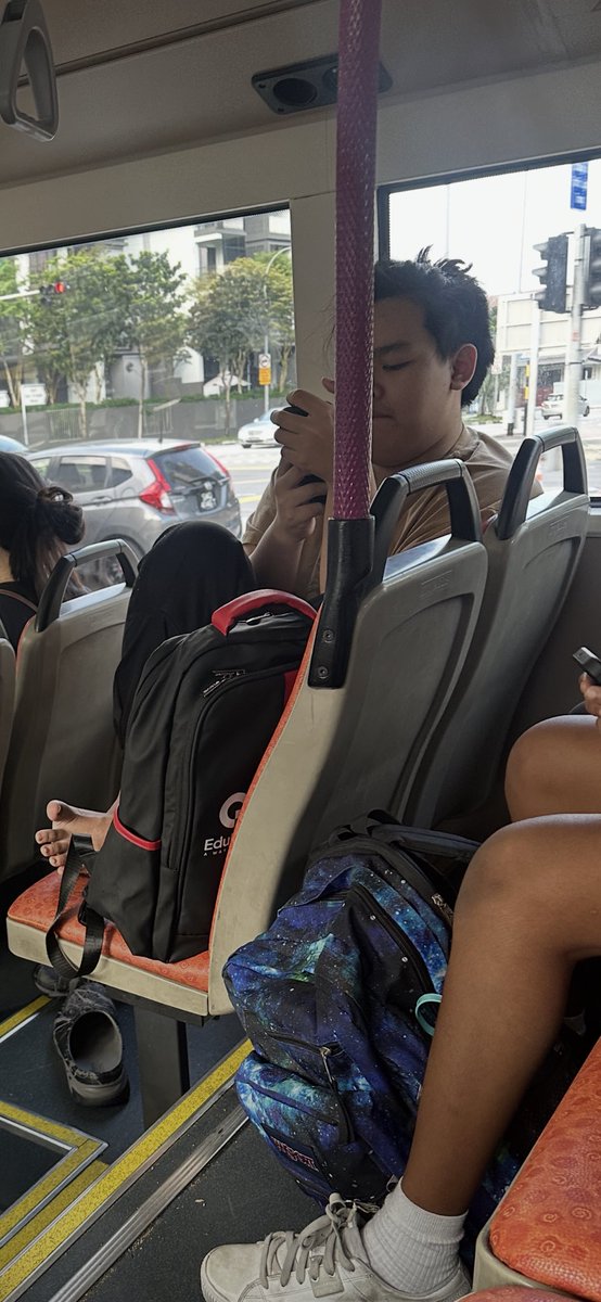 stormXXX's tweet photo. Inconsiderate to the max - oblivious to his bad behavior - feet on chair and occupying both seats in crowded bus - Bus 133 https://t.co/XScPvcLYc7