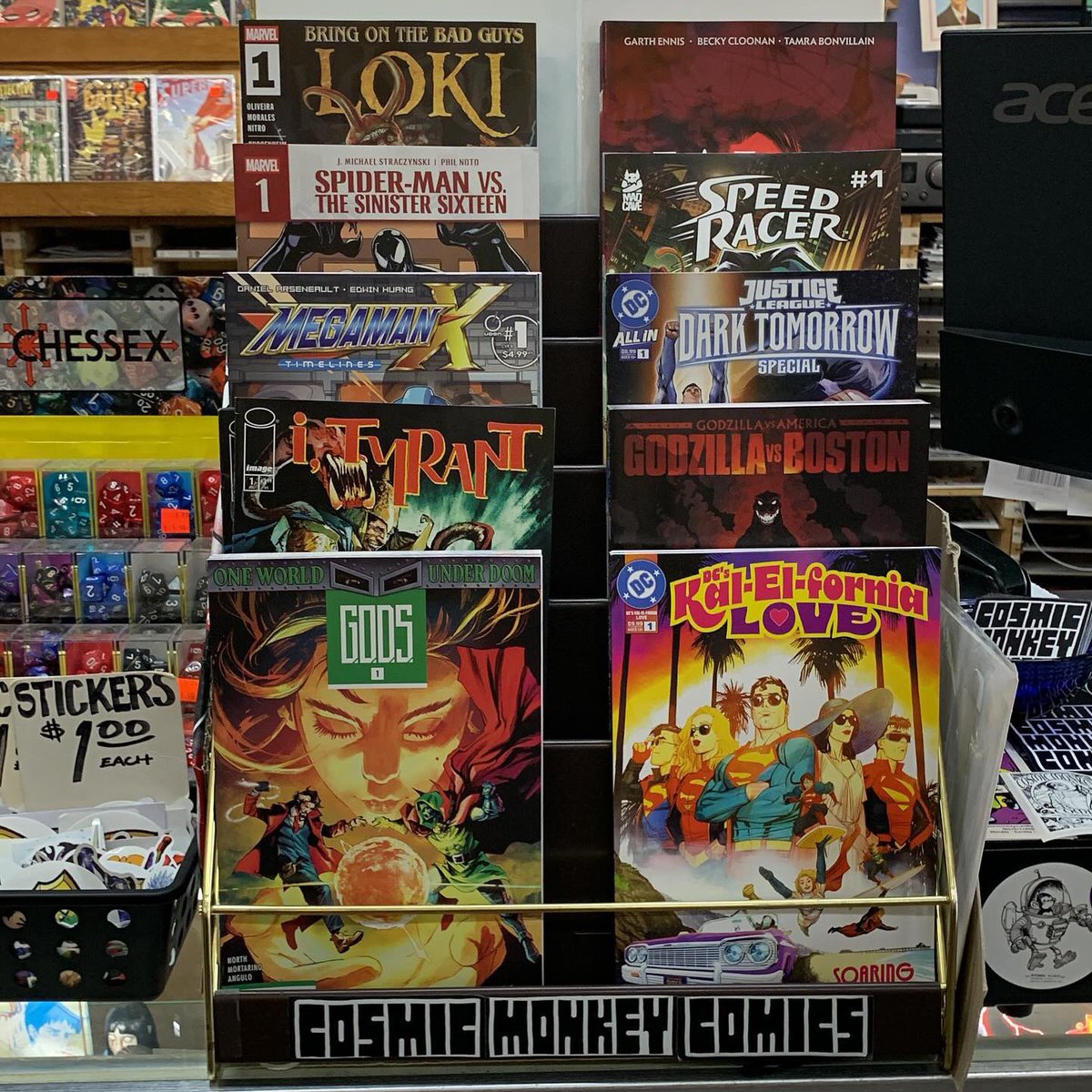 Here’s our featured rack! #gods #dcskalelfornialove #ityrant #godzillavsboston #megamanxtimelines #justiceleaguedarktomorrowspecial #spidermanvsthesinistersix #speedracer #bringonthebadguysloki #ncbd #cosmicmonkeycomics #newcomics