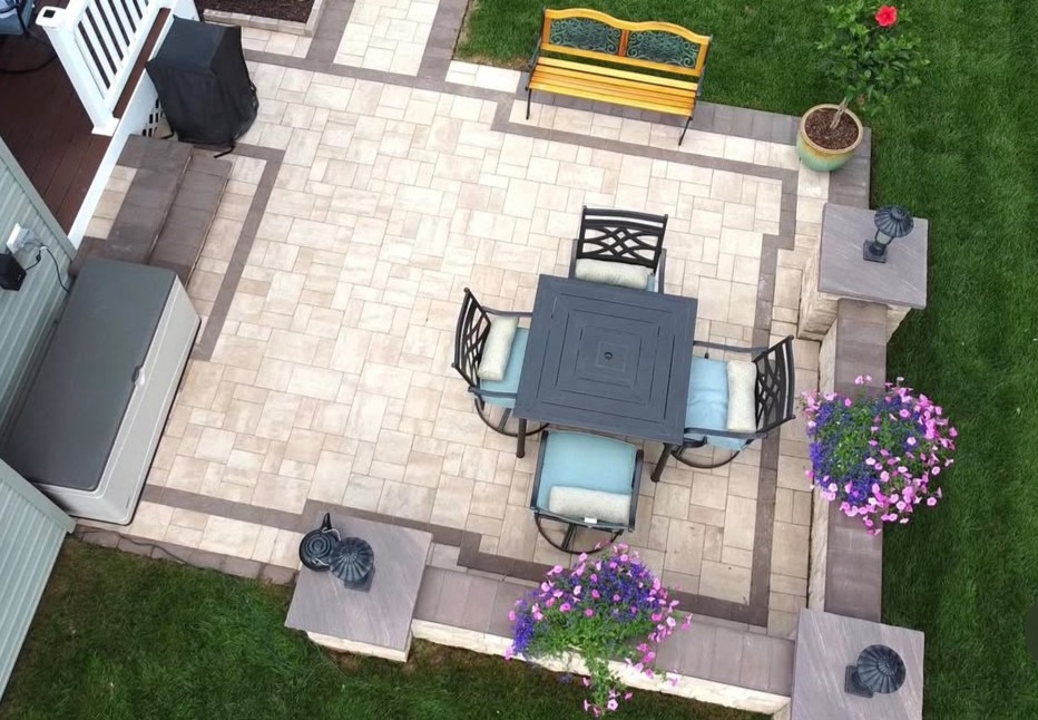 Proof that smart design never goes out of style. This cozy, structured patio by Strongtower Construction LLC. blends elegance and function, using Cambridge Pavers to define a dining area that feels custom and inviting. 

Explore more at cambridgepavers.com