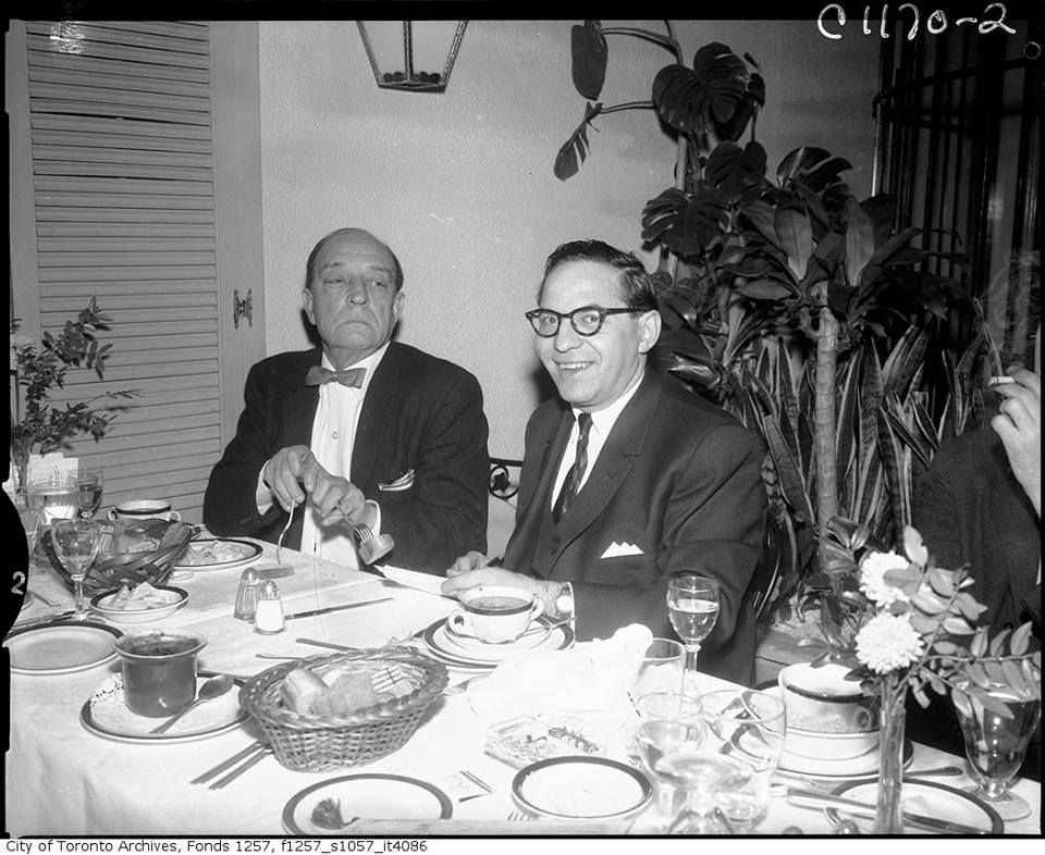 Frank Rasky is sitting at a table with pen and paper in hand while #BusterKeaton is being Buster Keaton.

Thank you, Ellyn Acord, on <a href="/Pinterest/">Pinterest</a> for this great shot.