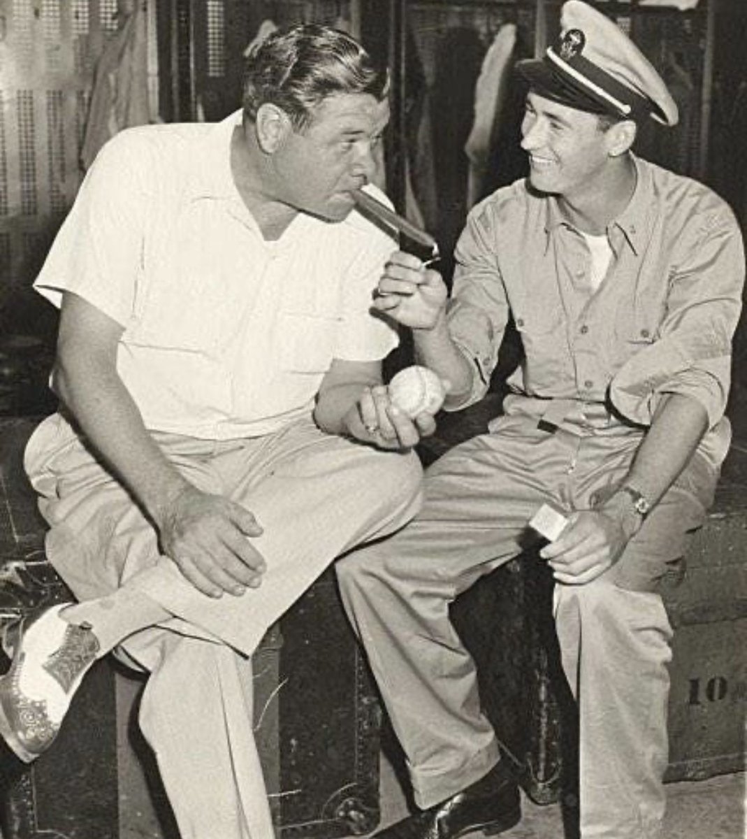 Ted Williams lights up a cigar for his hero, Babe Ruth