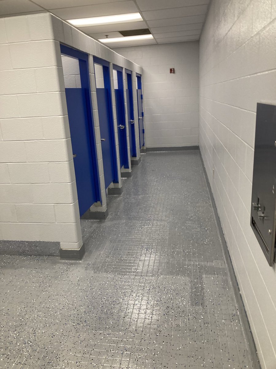 Epoxy floor paint on the restrooms floors at the auxiliary gym at Nelson Co HS.