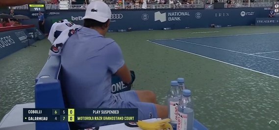 JacobPacheco6's tweet photo. Oh no...

Now rain coming down in Toronto. Players leaving the court as play suspended for now, but it seems it will "pass quickly," heard from the chair umpire.

This gives Cobolli some extra time for that left knee to get more treatment.

What timing. #NBO25 #ATP https://t.co/5qVO7MXkb1