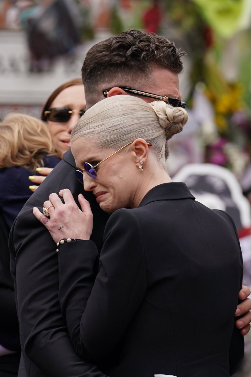Kelly &amp; Jack Osbourne shared a heartbreaking embrace at Ozzy procession.