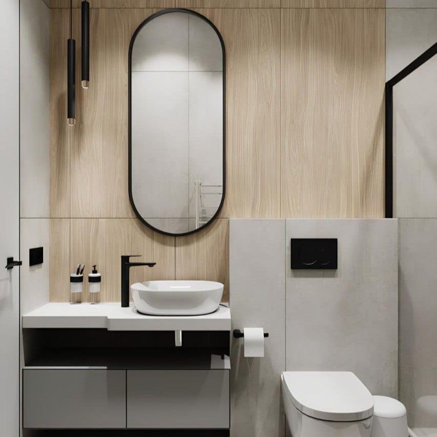 EMPCON_AU's tweet photo. Modern bathroom with wood paneling and oval mirror above a white sink. https://t.co/r7fSRMXKgY