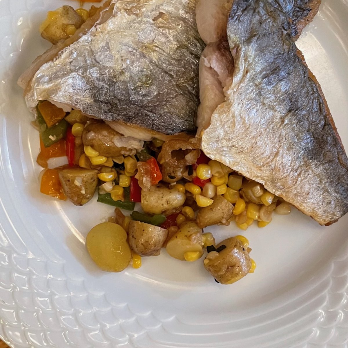 Lovely mackerel from Catch of the Hamptons at today's Dag Hammarskjöld @grownyc market (which we got to this morning even though the temperature was already in the 90s Fahrenheit) set on a hash of corn, tiny potatoes, Tropea onions &amp; several colors of peppers. A harmonious dish.
