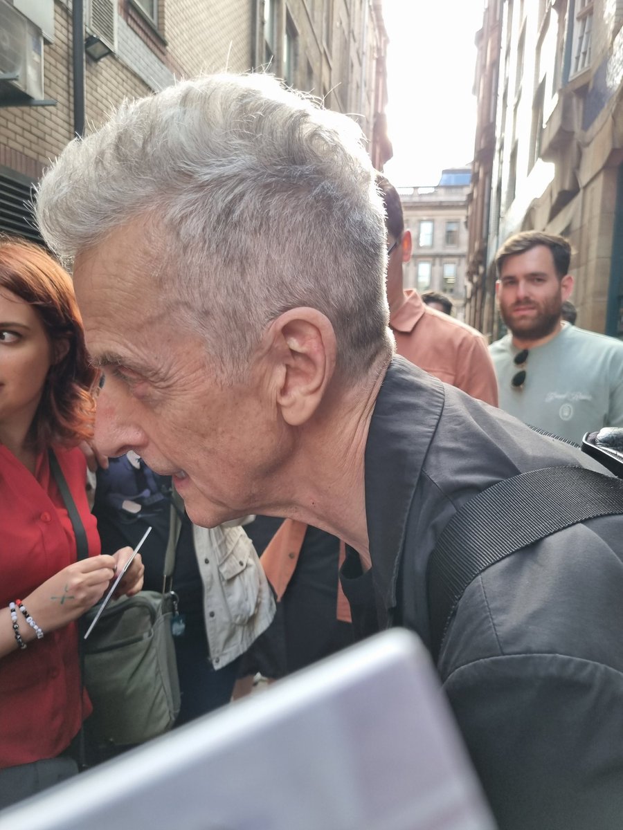 PCapaldifan's tweet image. Peter Capaldi signing and posing for photos before the gig tonight (30th). Thanks to Kay for the photo she took of me asking Peter to sign my CD. #PeterCapaldi
