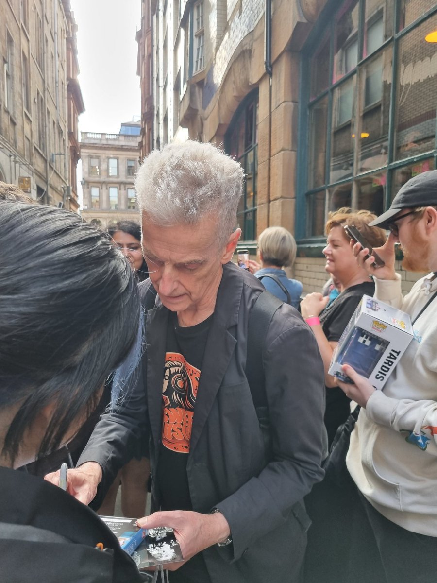 PCapaldifan's tweet image. Peter Capaldi signing and posing for photos before the gig tonight (30th). Thanks to Kay for the photo she took of me asking Peter to sign my CD. #PeterCapaldi