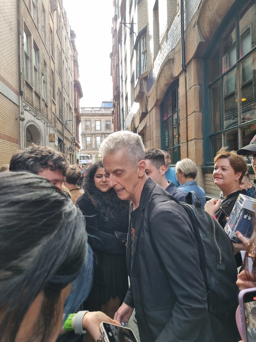 PCapaldifan's tweet image. Peter Capaldi signing and posing for photos before the gig tonight (30th). Thanks to Kay for the photo she took of me asking Peter to sign my CD. #PeterCapaldi
