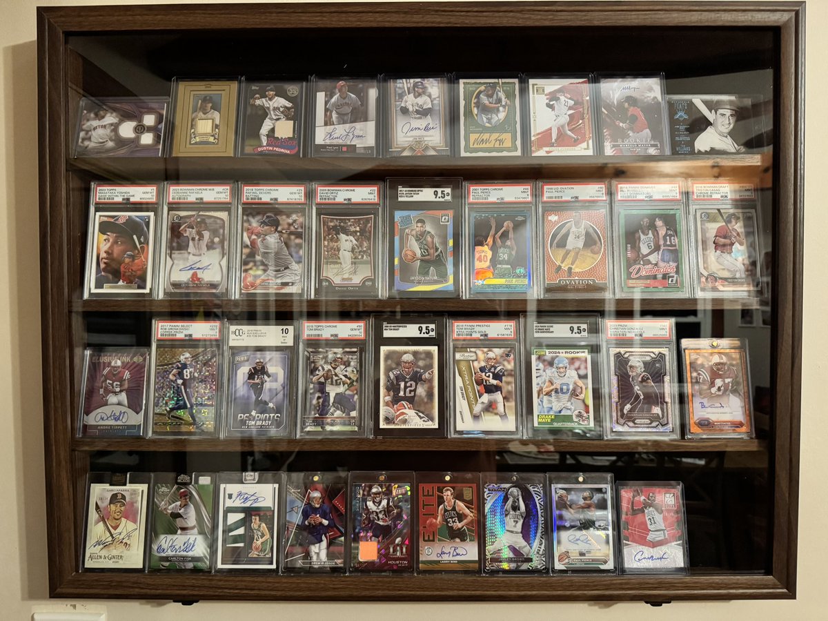 So I finally got around to turning a pile of my favorite cards tucked away in a box into something that actually feels like a collection now. Kinda shocked the wife let me hang it on a wall upstairs 😂 but I love it. My favorite card is tucked away in the bottom right corner. It