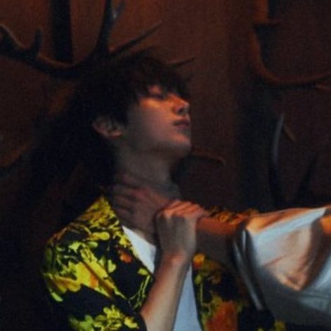 usually being in a chokehold would incite panic in someone but he's smiling and looks... pleased??? that's interesting...