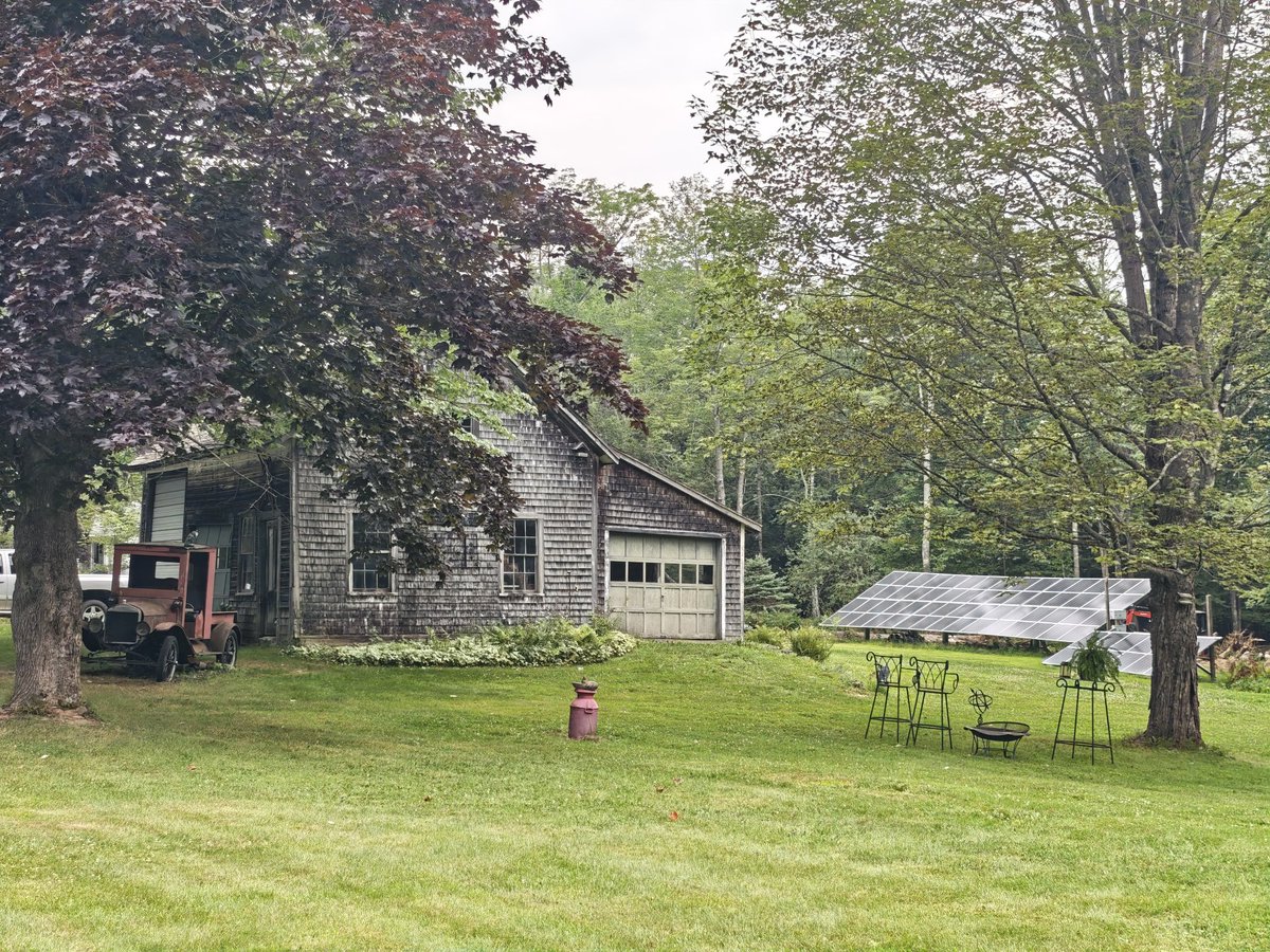 Solar panels in the backyard, rusting 100-year old pickup truck in the front yard (currently used as flower planter).

Dexter, Maine, USA