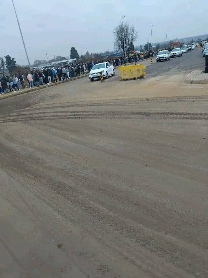 Many unemployed individuals lined up to submit their CVs at the newly constructed Bronkhorstspruit Mall. South Africa faces a significant risk with a high unemployment rate.