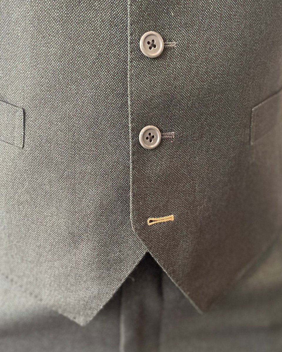 Even the smallest details let your personality shine through. 

Here's Gabrielle looking fabulous in her three-piece, single-breasted suit, which includes a mustard bowtie that complements the feature buttonhole on the waistcoat and sleeves, as well as her amazing socks.