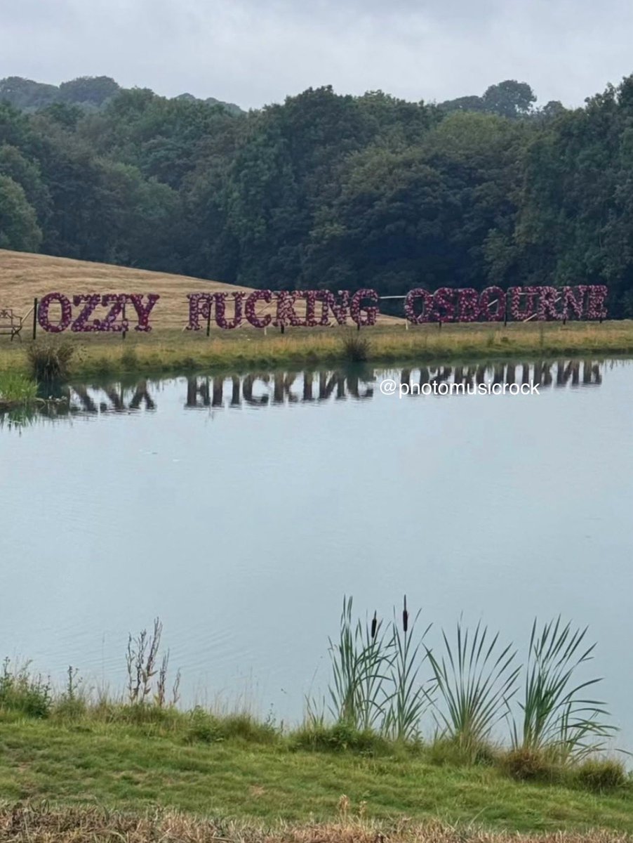 Exclusive! A huge floral arrangement in the grounds of the mansion spelled out a tribute to Black Sabbath late singer, with the words "Ozzy Fucking Osbourne" on the banks of the Osbourne lake.