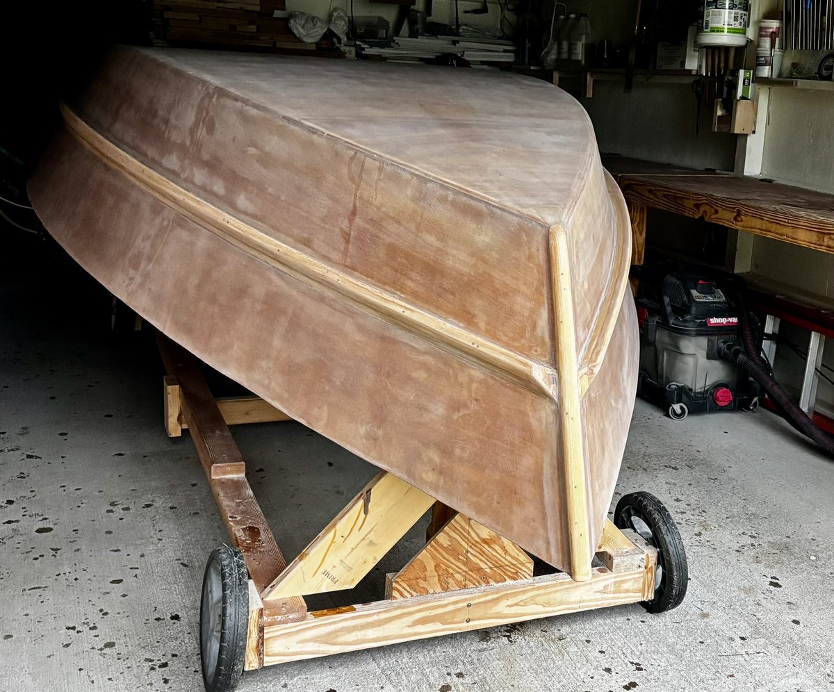 All sanding is completed! I washed the hull outside today with hot water and a scrub pad, rinsing often with a garden hose. I also cleaned all of the dust out of my workspace. The next step is epoxy primer.