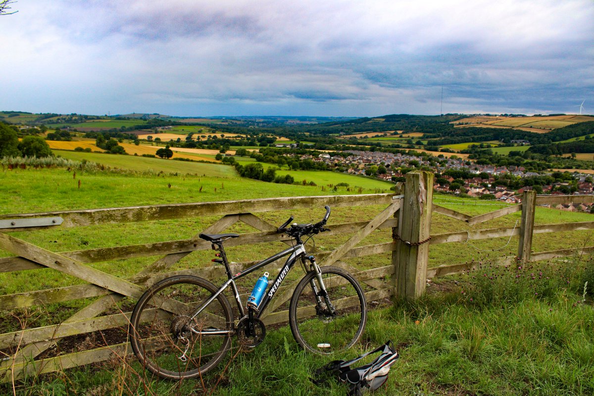 Chainsaw_McGinn's tweet image. This morning&apos;s scoot around my corner of Co Durham. Damp, warm, muggy and most enjoyable. I always stop here for the view and there are often horses at the gate which would make a great painting, but my bicycle took their place in the foreground today. #DH7 #cycling #CoDurham