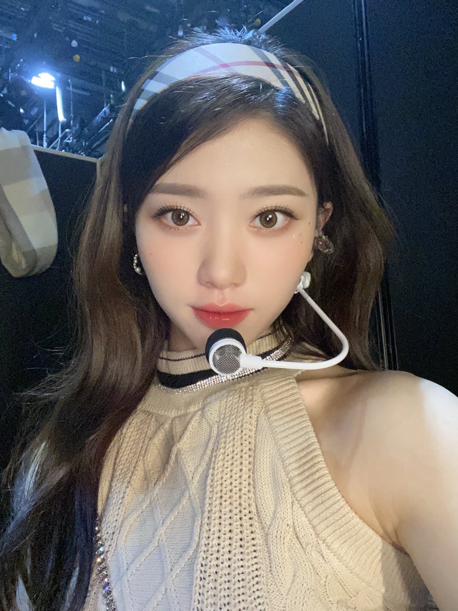 Her complexion was luminous, and her eyes were accentuated with precise lines and subtle shades. Her lips were painted with a perfect blend of color and precise application. All conversation ceased as everyone fixed their gaze on her beauty, down to the last detail. ⊹