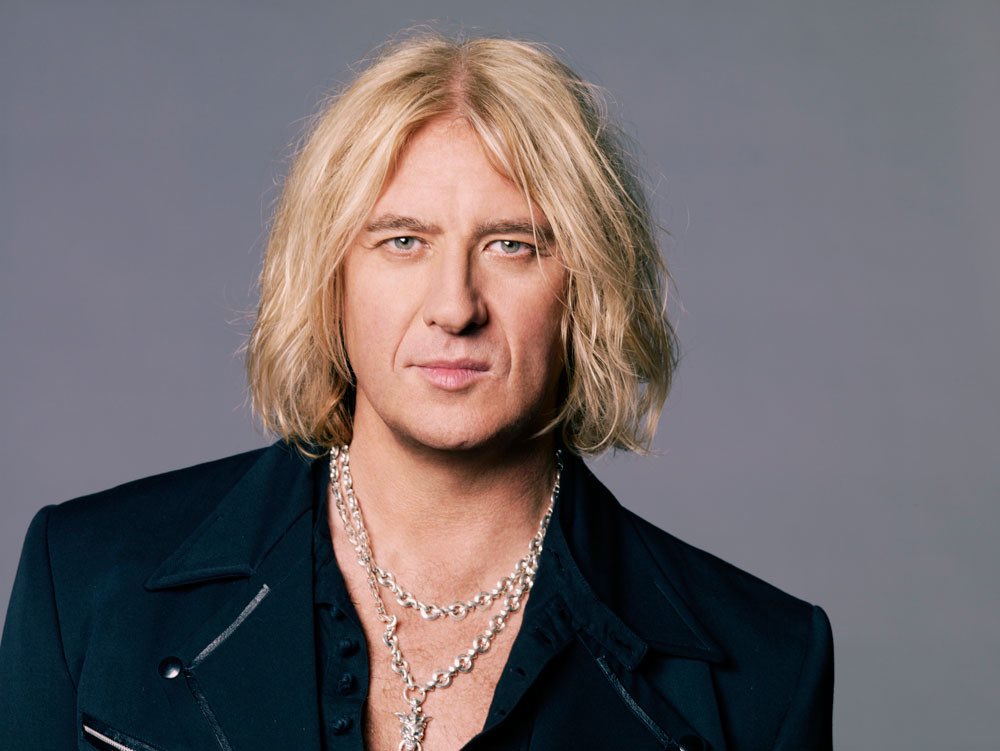 rocknriff88's tweet photo. Joe Elliott has been my idol since I was 8 years old. I’d go around the house with a scarf on my mic stand like he used to do and sing along to the hits. 

Many birthdays to hopefully come. Don’t go anytime soon. Still more to always accomplish. Forever a legend🤘❤️‍🔥 https://t.co/yMWMOsRYRh