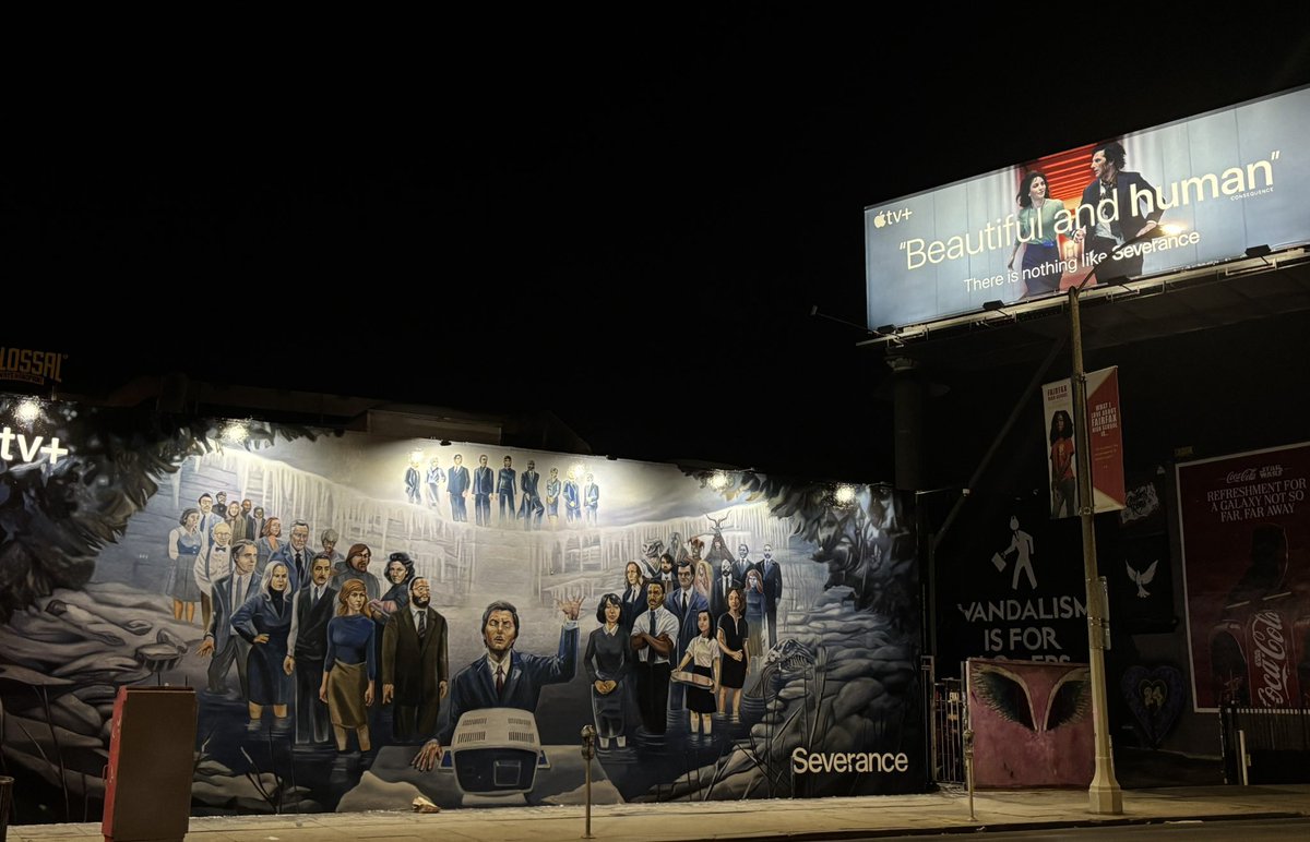 lionesspike's tweet photo. new night shot of the severance cold harbor mural and billboard! she’s glowing✨ https://t.co/LTtWHN2gRd