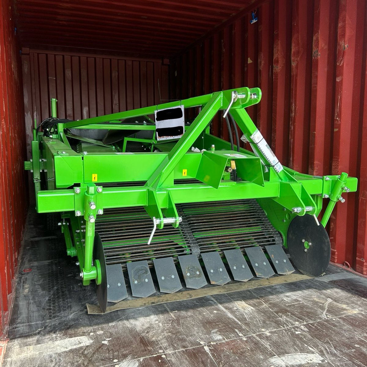 A new Single Windrower loaded into a container and on route to Kenya