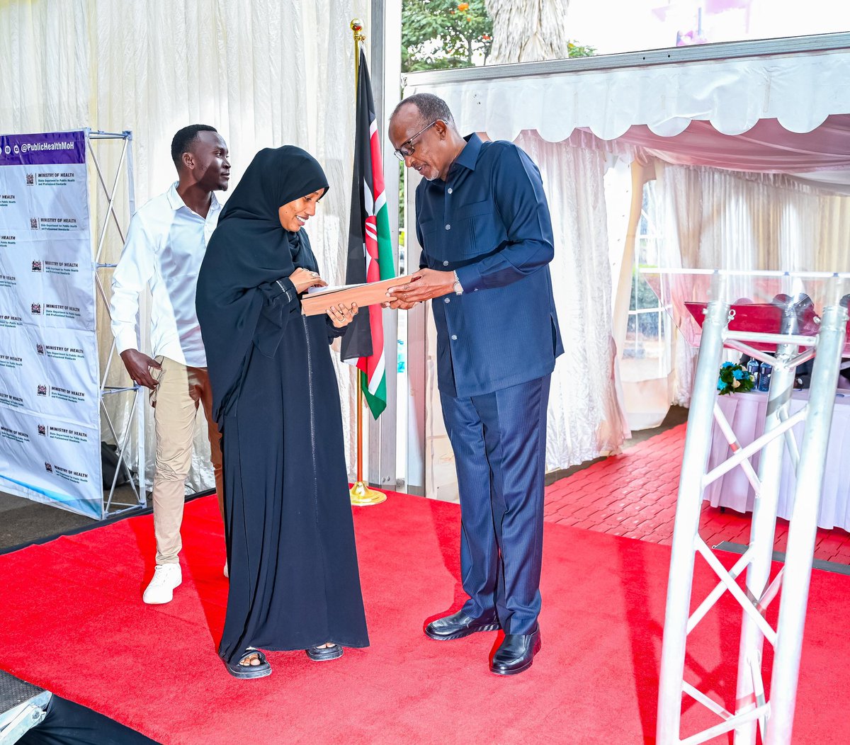MOH_Kenya's tweet photo. Health Cabinet Secretary Hon. Aden Duale today flagged off 316 Bachelor of Science in Nursing (BScN) graduates at Afya House, Nairobi, whose internship placements were reinstated following a Ministry audit into posting irregularities. https://t.co/s6kIqq6Ycz