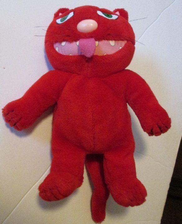 "12" plush of 1987 Determined Productions ROTTEN RALPH, a not very nice CAT, in his bright red fur, whiskers, ugly teeth, long tail, and devilish ears."