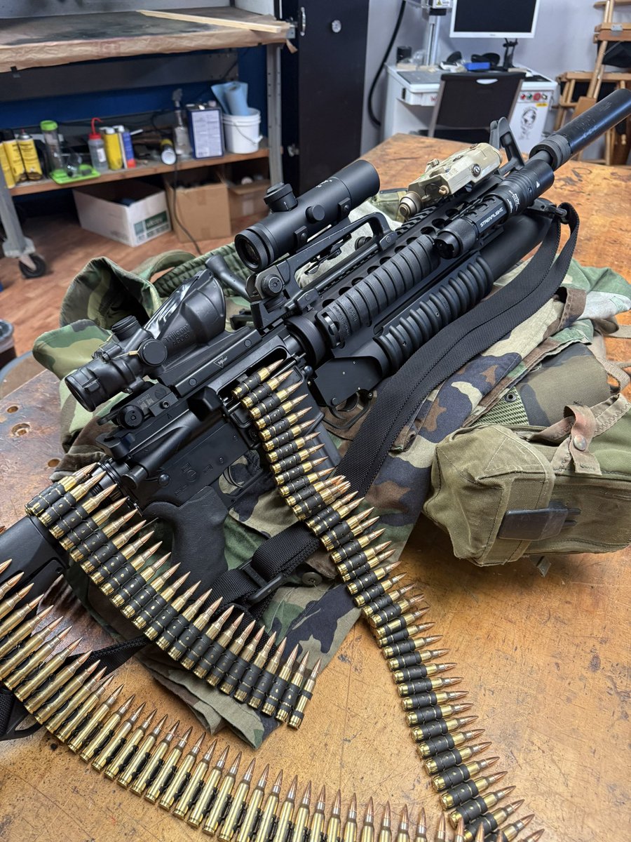 BrownellsInc's tweet photo. We have compiled all of your comments and suggestions into our super-duper computer and assembled the average result. Before you is a belt/ box magazine fed, 20-inch suppressed rifle chambered in 30-06. Dual iron sighted, dual magnified optics, equipped with laser aiming module, weapon light, M203 underslung grenade launcher and grip-pod for chow hall operations. Accompanied by ALICE web gear and M81 blouse (sleeves rolled). Magazine inserted, sling attached. The stock is now collapsible, much like the mind of the social media guy we had during this community effort. He is sadly now institutionalized because his weak mind could not comprehend the shear glory of this build. Send prayers. Let’s do it again sometime.