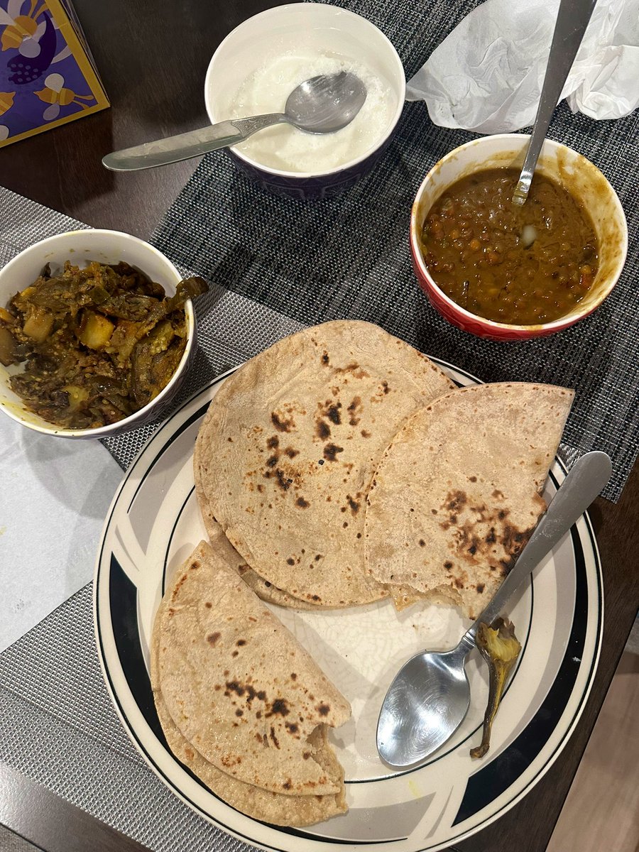 Even if you reach your family’s home close to midnight, they still insist on feeding you freshly cooked Indian food! 😻

Daal with ghee, jammy eggplant potato fry, fresh off the pan roti flatbread, &amp; homemade dahi yogurt. 

#twittersupperclub #Indianfood