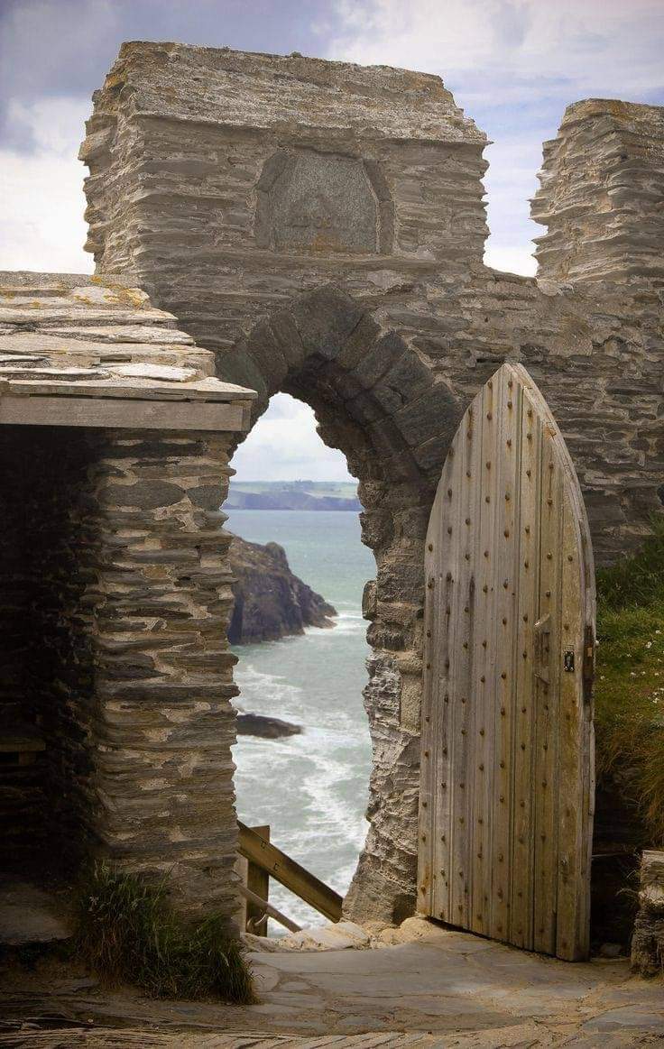 An otherworldly medieval portal to the sea at 13th-century Tintagel Castle, North Cornwall, UK.