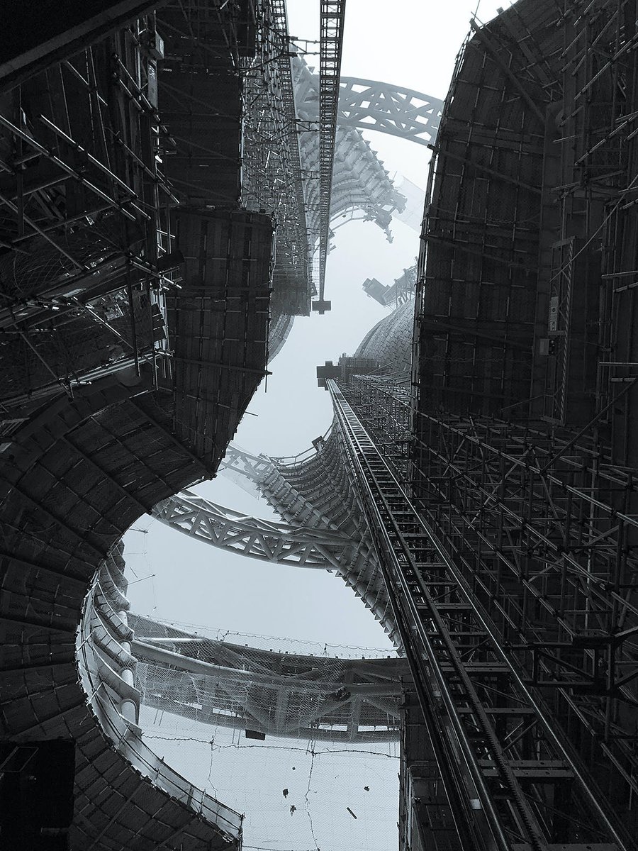 The accidental dystopia of major construction sites  

Zaha Hadid Architects' Leeza Soho Tower under construction as photographed by Satoshi Ohashi