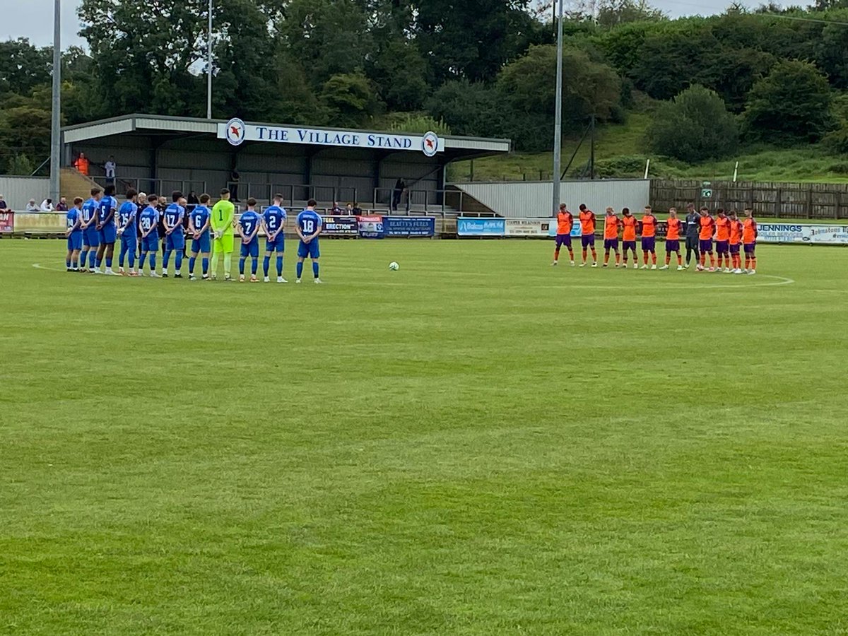 A minute silence in memory of those killed last week at Maguirebridge was impeccably observed prior to the Ballinamallard United v Linfield game at Ferney Park