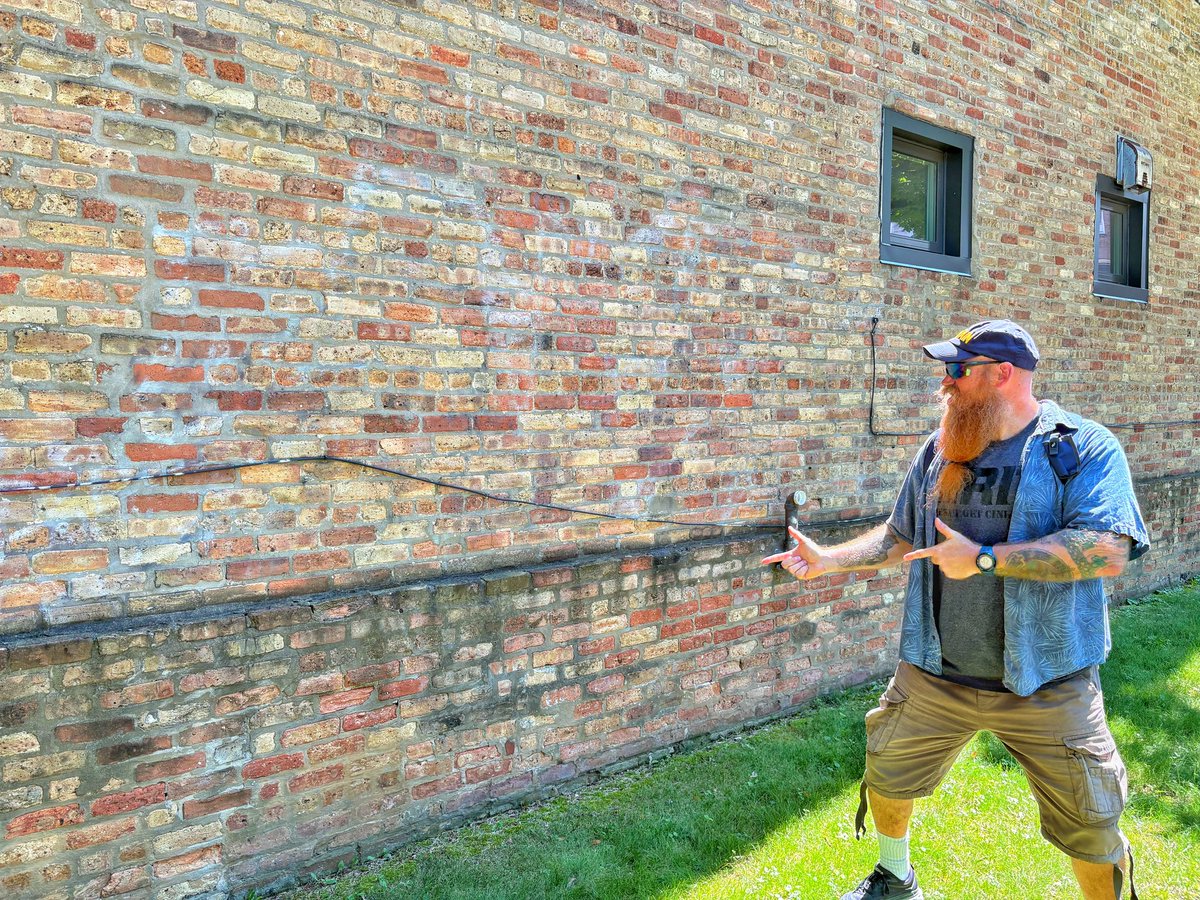PresidentBeard's tweet photo. DAY 7: One of the gems Fraser found in Chicago is where the St. Valentine’s Day Massacre took place in 1929.
This wall is THE WALL… formerly in a parking garage. The bullet-hole laden bricks were removed and are in a museum in Las Vegas.
#HartnellSummer #HartnellHistory https://t.co/Dt3EWUzvuc