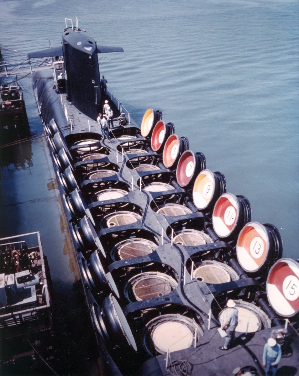 USS Sam Rayburn nuclear submarine, Virginia, 1964. Note open tubes for Polaris missiles, with hatch covers colored and numbered in Billiard Ball style.