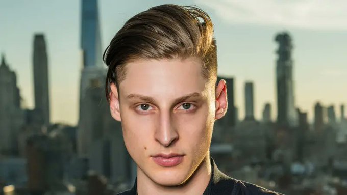 Ben Pasternak with a city skyline in the background
