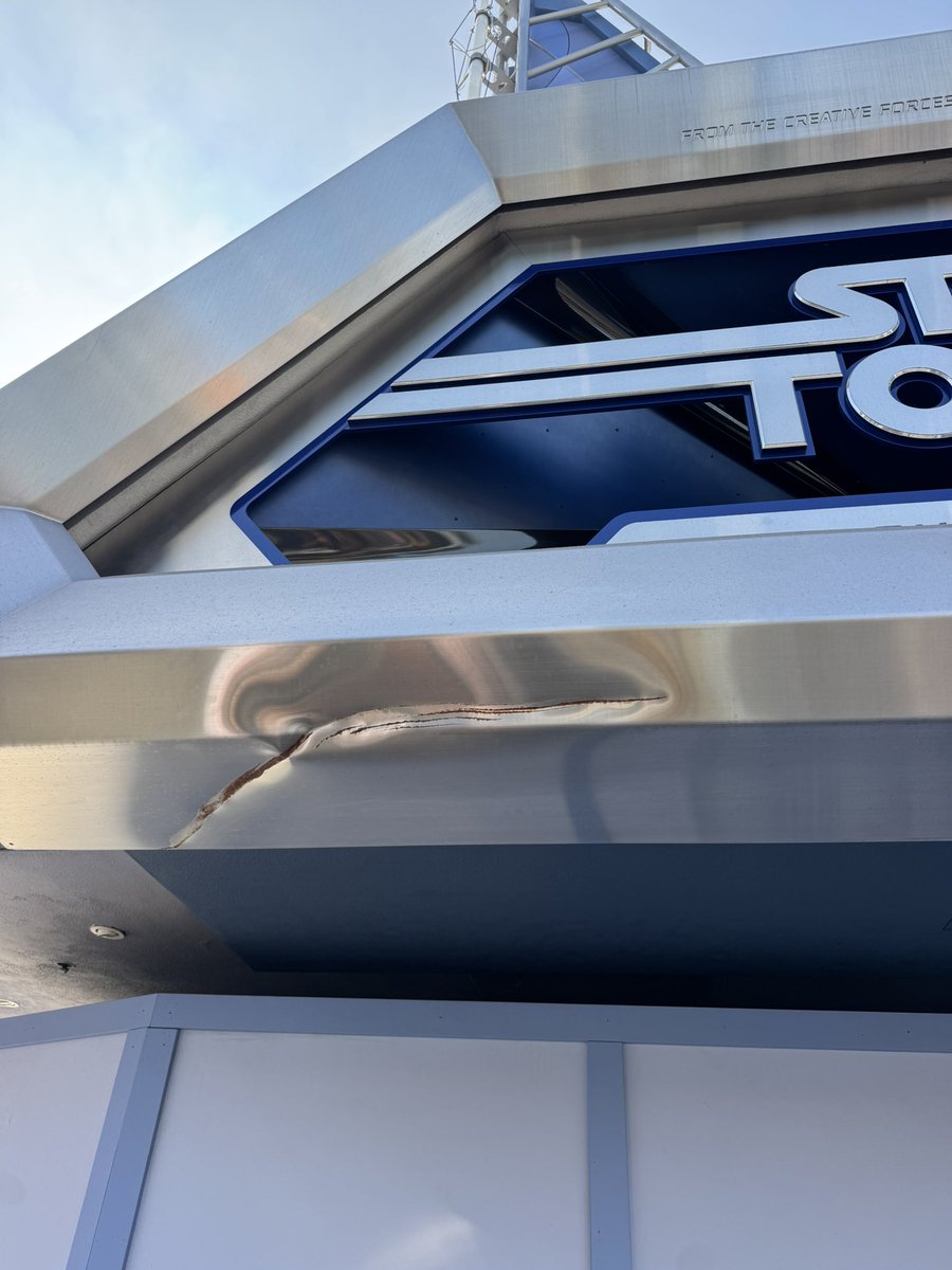 At some point something crashed into the Star Tours sign at Disneyland