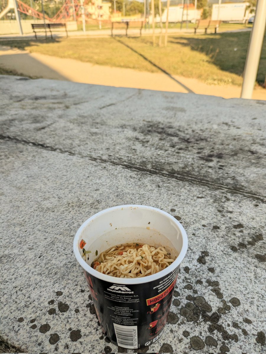 eating cup noodles (been craving them for weeks) in a park somewhere in portugal at 7 pm, listening to someone singing billy joel’s piano man with his guitar. life is good.