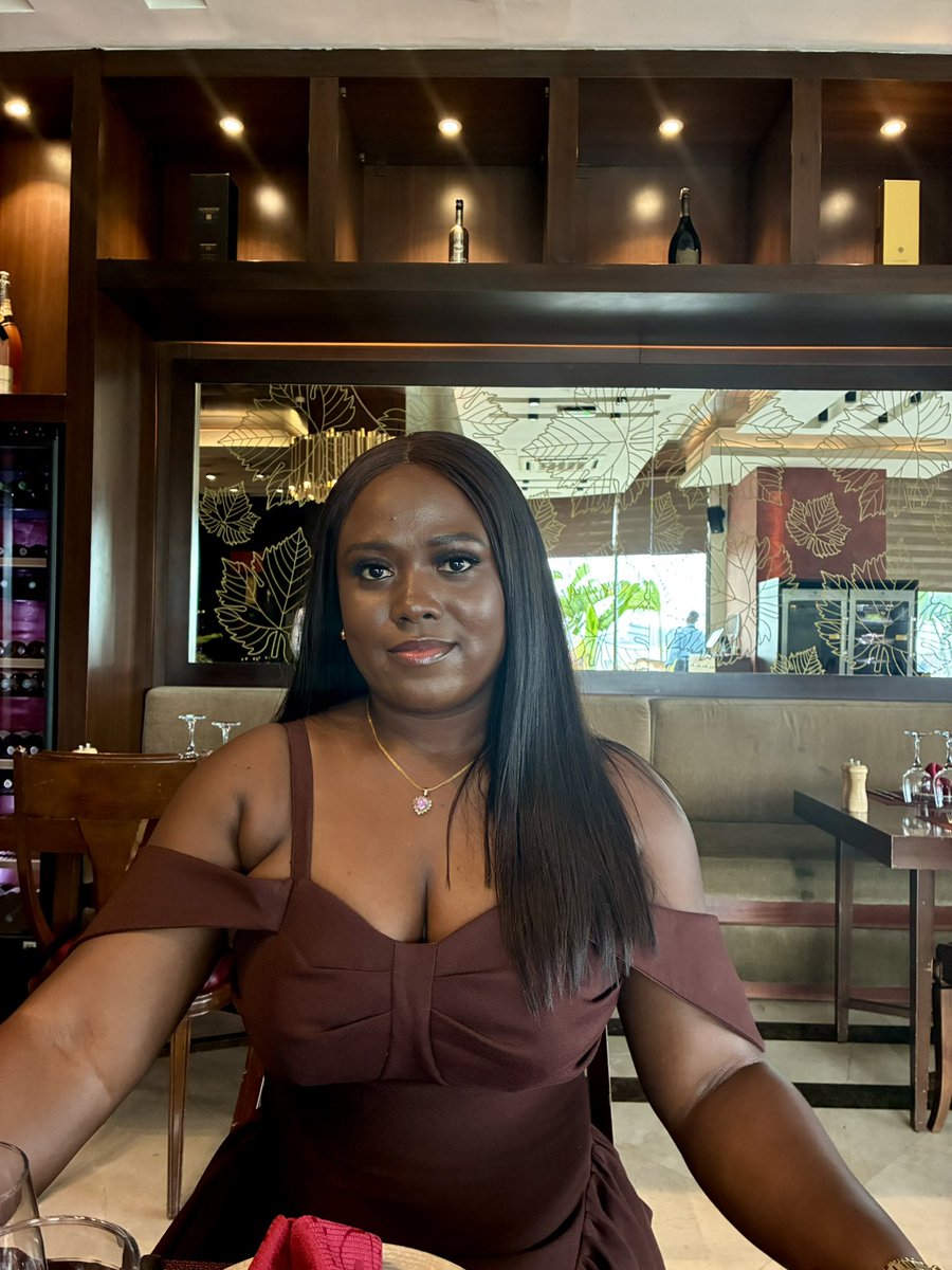 A brown-skinned beauty wearing a brown dress that she made herself. 🤎