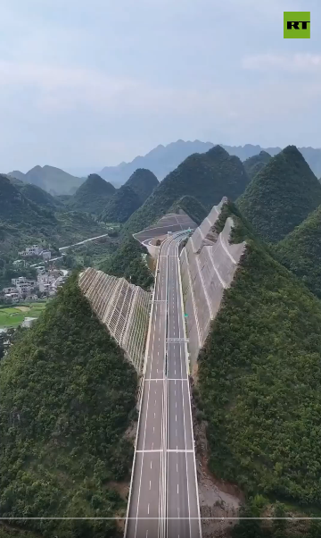 China slices mountains to build this sky-high highway.