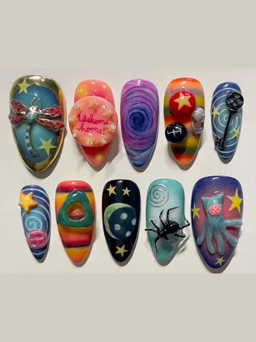 pinkglitterie's tweet photo. Coraline nail art for fall 🍂 https://t.co/nhpikSaN5Q
