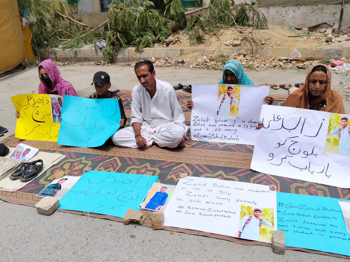 BalochYakjehtiC's tweet photo. Today is the sixth consecutive day that the family of Zahid Ali, a 25-year-old International Relations student at the University of Karachi, has been sitting in protest outside the Karachi Press Club. Zahid was forcibly disappeared by Pakistani forces on 17th July 2025, along with his rickshaw, which he drove part-time to support his family.

Led by his ailing father, Abdul Hameed, a hepatitis patient—the family continues their sit-in, demanding Zahid’s immediate and safe release.

Zahid has now been missing for 24 days. His disappearance is part of the wider pattern of enforced disappearances of Baloch in Karachi and Balochistan.

We urge students, rights activists, journalists, and the people of Karachi to stand in solidarity, visit the camp, and amplify the call for justice.

#EndEnforcedDisappearances
#StopBalochGenocide