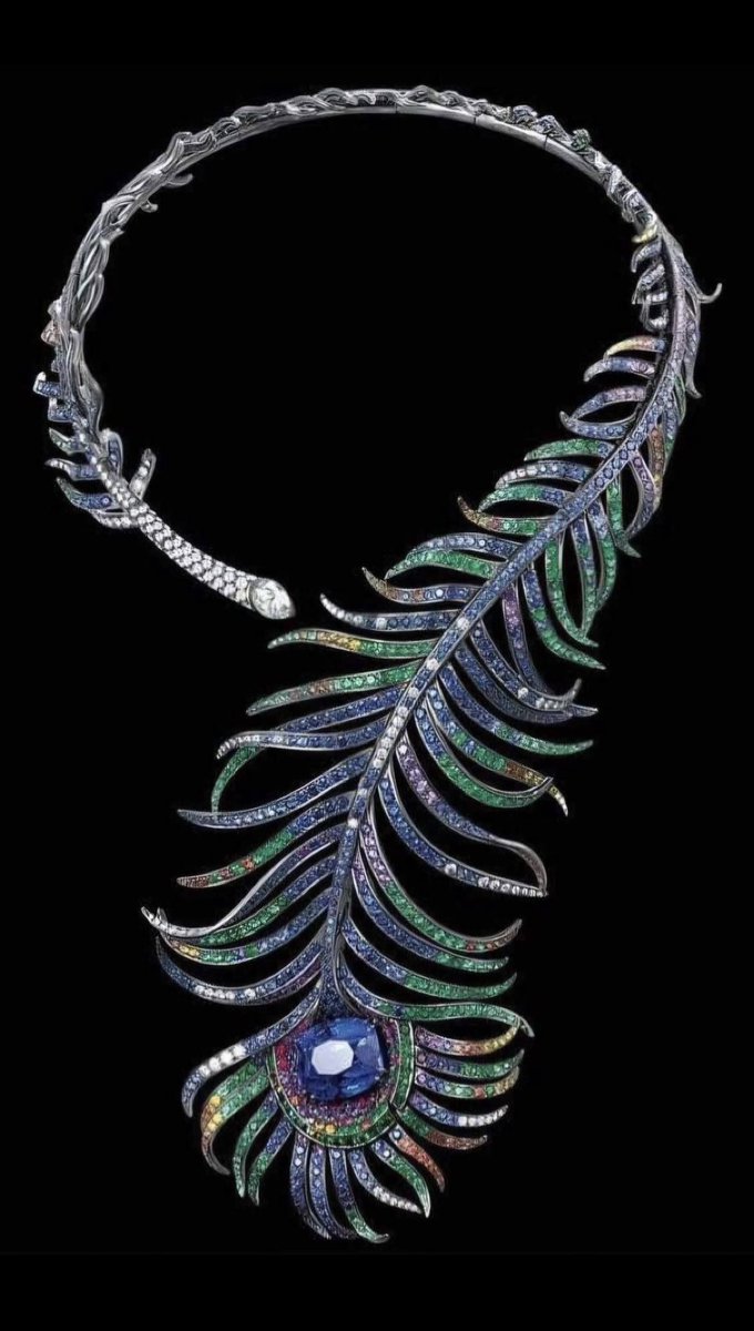 The "Peacock Feather" necklace was crafted by Boucheron in 1883, a unique piece inspired by peacock feathers, featuring exquisite design and craftsmanship.