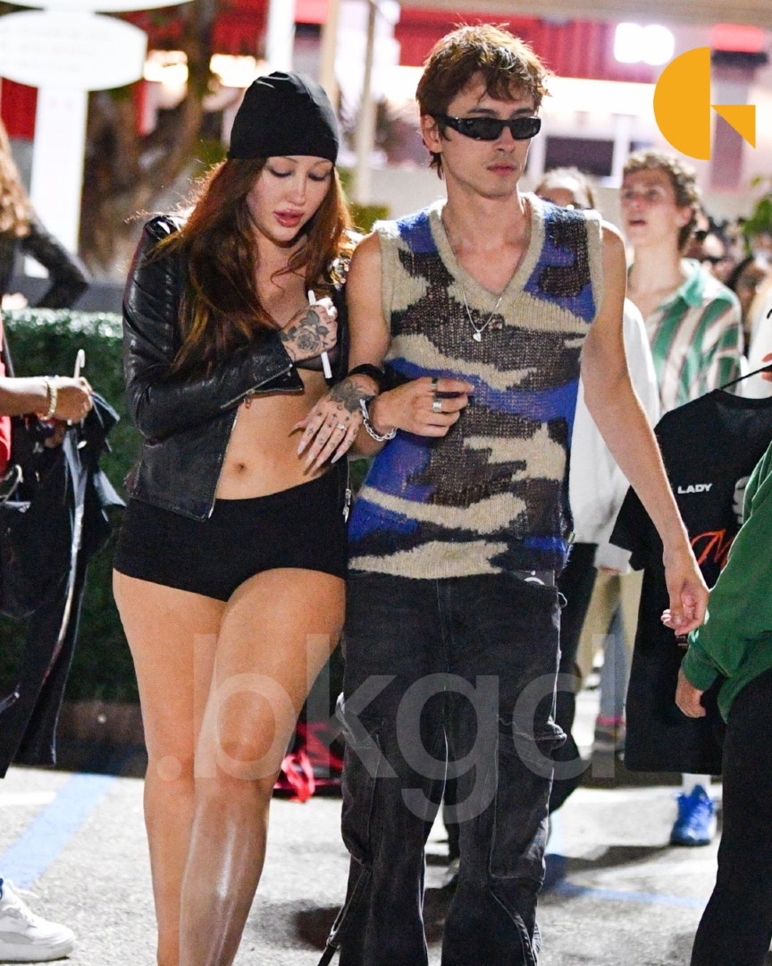 BackgridUS's tweet photo. #NoahCyrus and her fiancé #Pinkus made a stylish exit from #LadyGaga Mayhem Ball in Los Angeles. 

The couple attended Gaga’s fourth and final performance at the Kia Forum

.📷: PGP | @backgrid_usa 

For licensing inquiries, please email us at usasales@backgrid.com  

#backgrid https://t.co/E53Pvq25CL