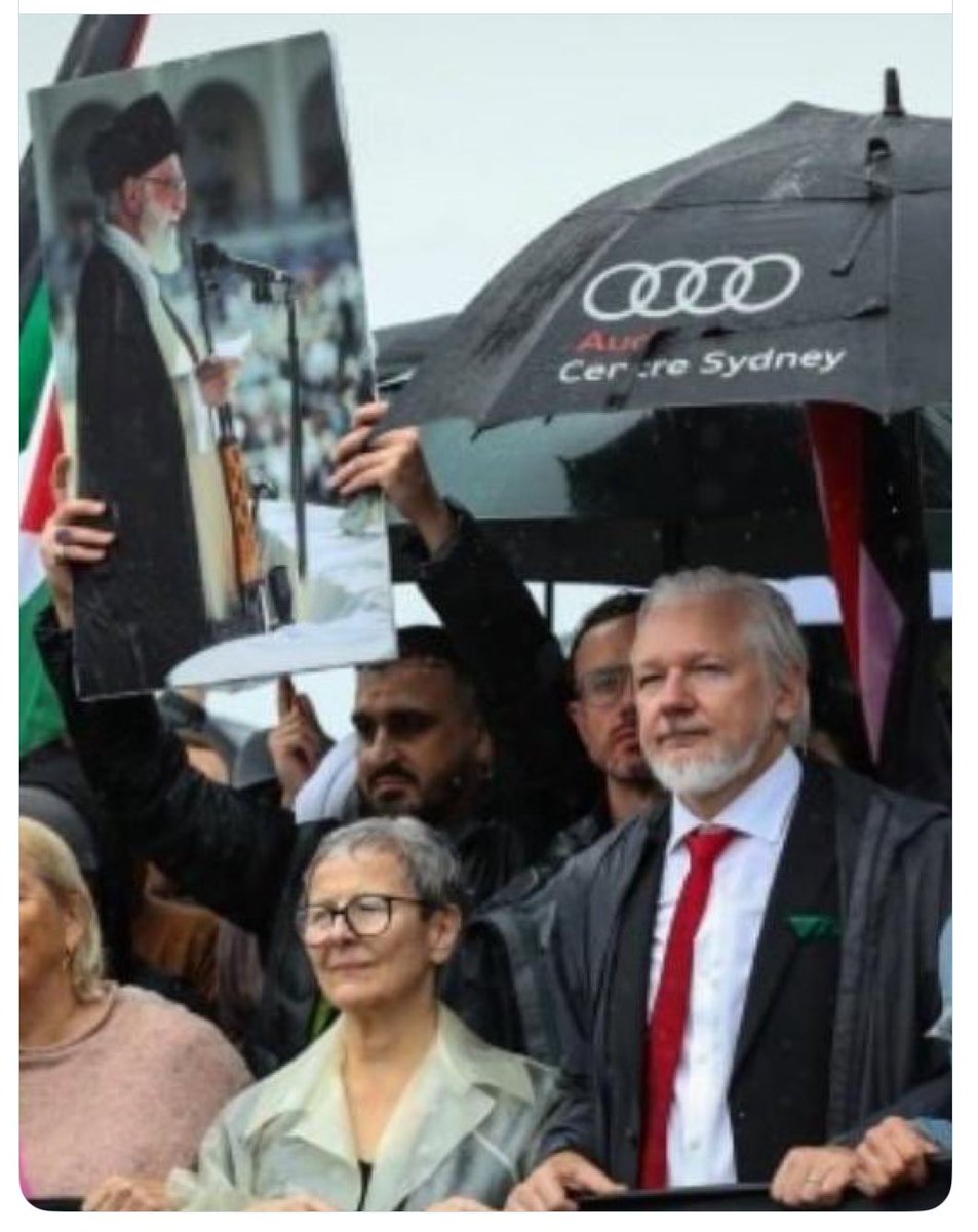 This image from yesterday breaks my heart ♥️ 

A man I once admired <a href="/JulianAssange_/">Julian Assange</a> masquerades as being at a march for humanity, as he knowingly walks alongside a photo of the Iranian leader. This is a country that gasses school children, commits femicide against women, and