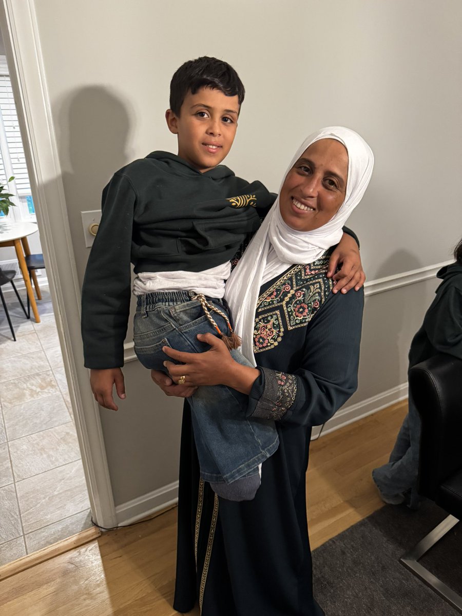This is Yassin, 12, and his mom. He just arrived today in Atlanta to start treatment through <a href="/healpalestine_/">healpalestine</a> after his legs were blown off by an IOF bomb. She carrying him because he was not allowed to bring his wheelchair out of Gaza and has had to be carried by his mom since